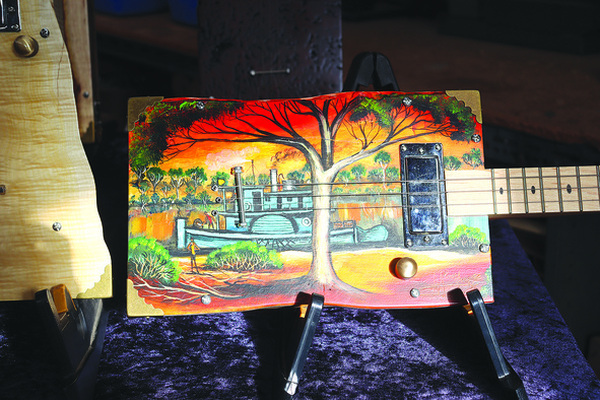A special guitar painted by Allan Boromeo in Moolap and is inspired by McKinnon's travels to Echuca and the Murray River.