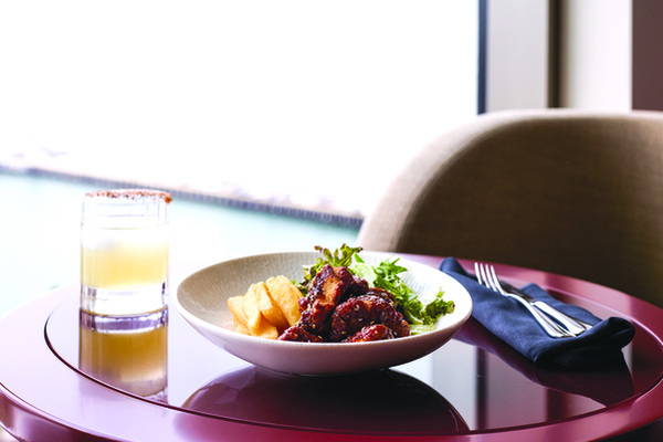 ABOVE LEFT: The best of Sociali combines Italian dining with a special twist and turn around every corner. ABOVE right: The Skyline Bar Karaage Chicken Midnight Tea in Paris Cocktail.