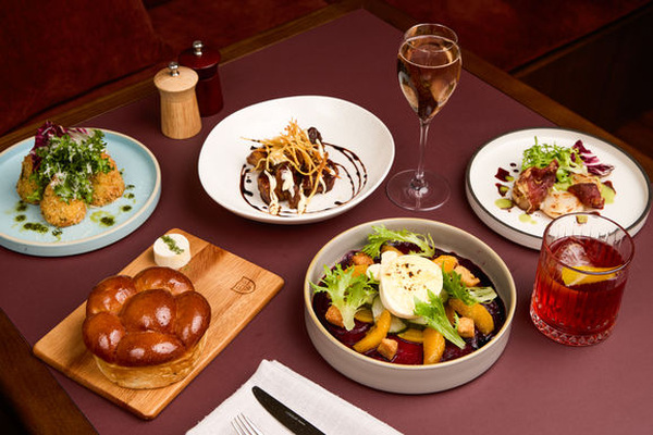 The anchovy butter bread (corner left) is a staple of the menu, alongside the salads, cured meats and arancini. Photo: Paul Bamford.