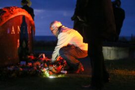 A wreath is placed at sunrise at Point Danger in Torquay, commemorating Anzac Day. Photo: PETER MARSHALL