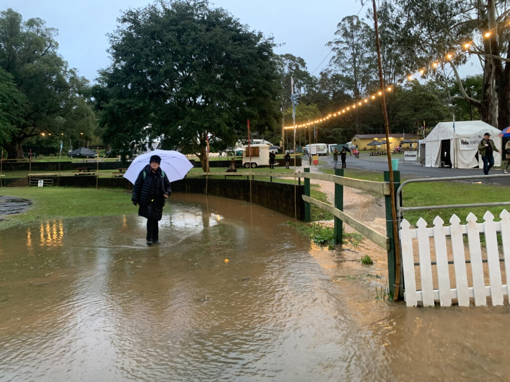 Rain, rain, go away: The festival opened to umbrellas and ankle-deep puddles on Friday, but worsening weather forced organisers to cancel the weekend program.