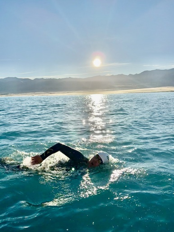 Brunswick Heads swimmer Edward Mason, who completed a 27-kilometre swim in New Zealand’s Lake Tekapo earlier this year to raise funds for the organisation. Photo: Supplied by Edward Mason.