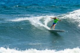 Melanie Staunton surfing