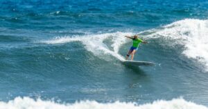 Melanie Staunton surfing