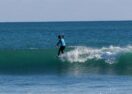 Bea Conroy surfing