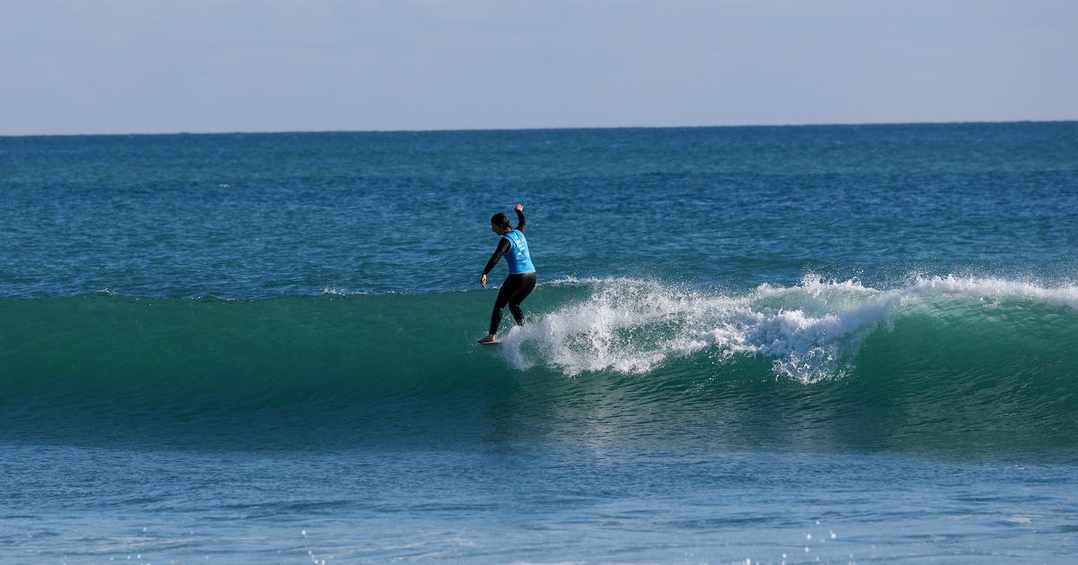 Bea Conroy surfing