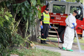 Emergency services wash down a Brunswick Heads street the day after a late-night incident. Photo: SUPPLIED