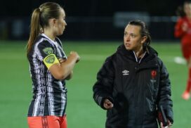 Female football coach mentoring