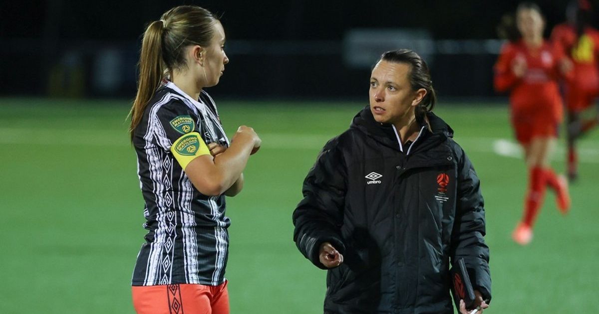 Female football coach mentoring