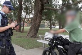 Not just young riders, an older man speaks with police as enforcement targets e-bike riders across all generations. Photo: supplied.