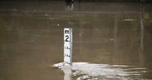 A flood marker is seen as Parramatta ferry wharf and river walk are flooded, at Parramatta, Sydney, Thursday, August 21, 2025. Photo: AAP