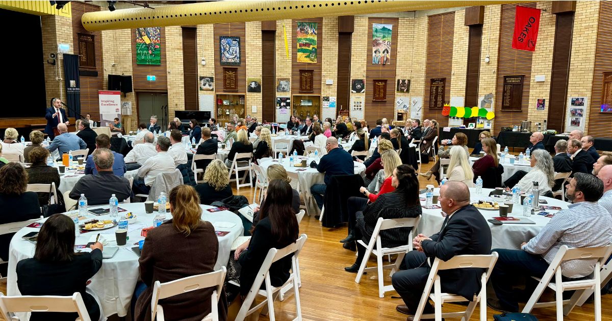 school leaders gather