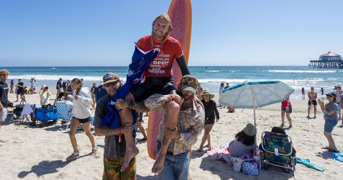 Byron Bay surfer Kai Ellice-Flint chaired up the beach after winning the men's longboard event at the Lexus US Open of Surfing at Huntington Beach, California. Photo: KENNY MORRIS/WSL