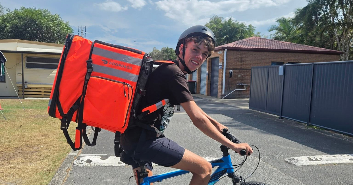 DoorDash delivery worker Zakia “Zak” Lovell rides his bike while completing deliveries. Photo: SUPPLIED