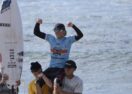 Lachlan Arghyros surfing