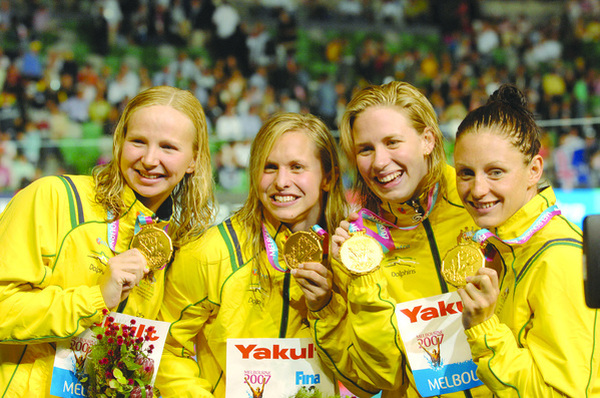 Australians Melanie Wright, Libby Trickett, Jodie Henry and Shayne Reese celebrate their victory in the women's 4 x 100m freestyle relay final at the World Swimming Championships in Melbourne in 2007. They won the gold medal with the championship record of 3 minutes and 35.48 seconds. Photo: Joe Castro/AAP Image/file.