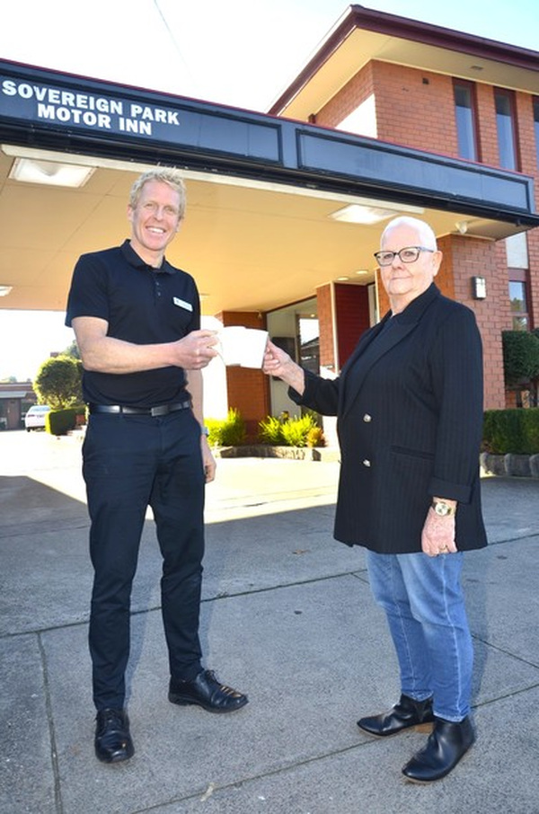 Sovereign Park Motor Inn owner-operator Tim Canny congratulates Carol Wright on her 40-year career at the accommodation venue. Photo: Evie Lamb.